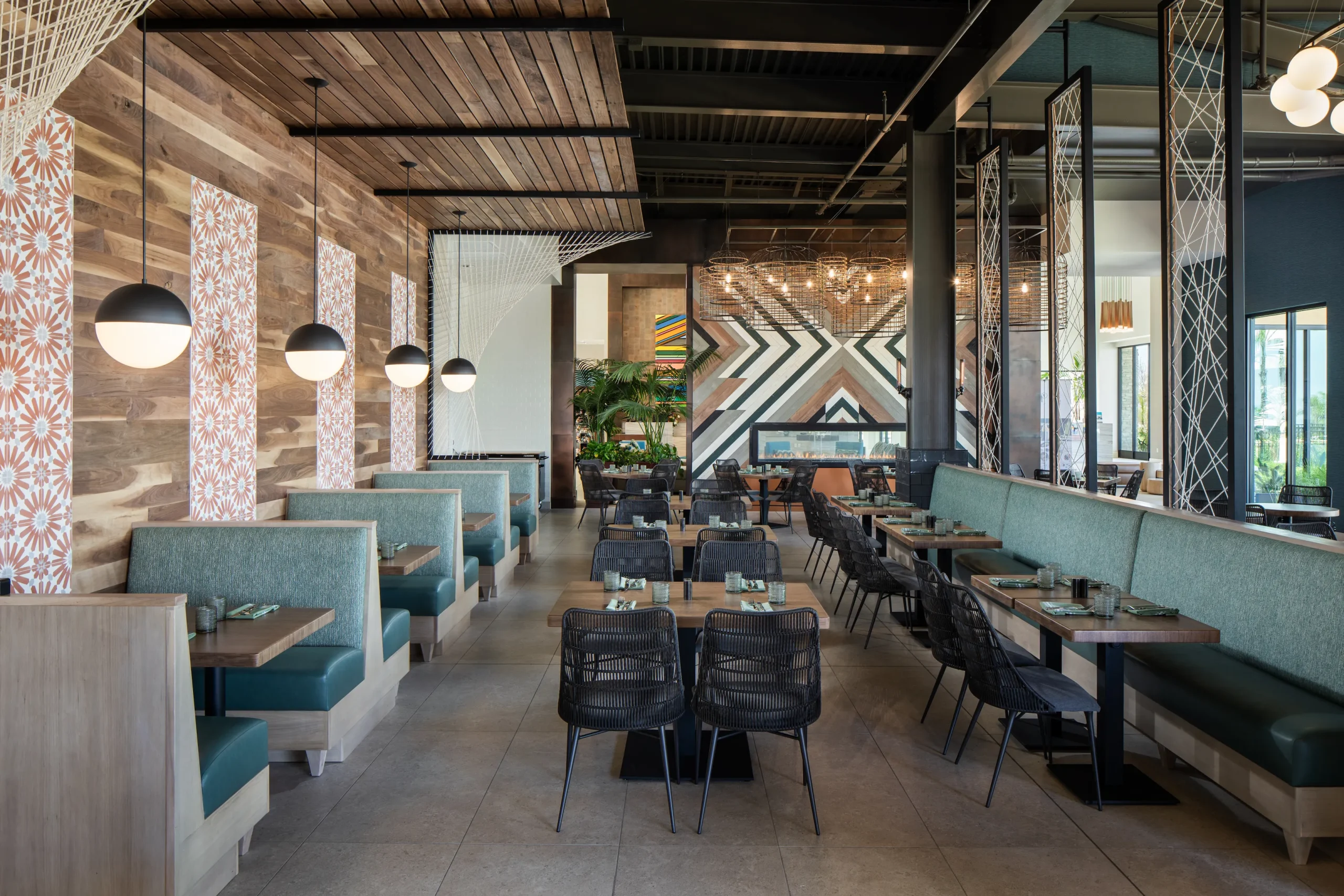 interior restaurant with wood walls blue chairs and woven chairs